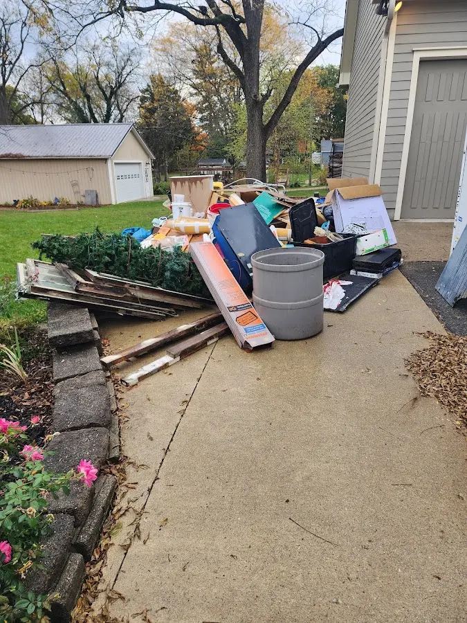 Dumpster being loaded with debris for 3 Yard Dumpster Rental in Horizon City
